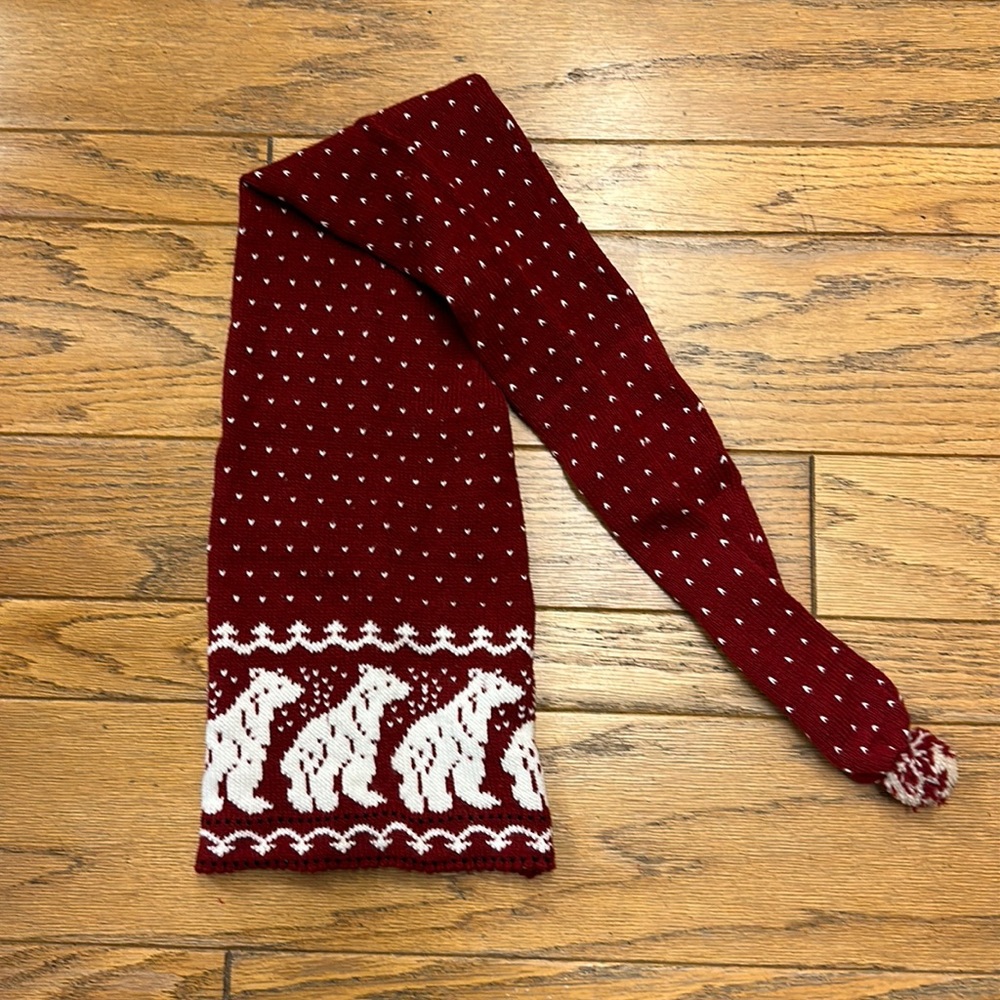 100% wool knitted cap with polar bear design and pom pom.  Never worn!